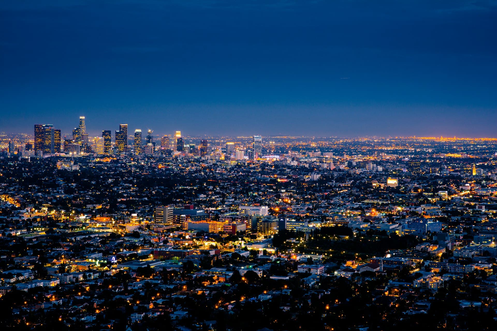 Connected city skyline at night representing technology and real estate